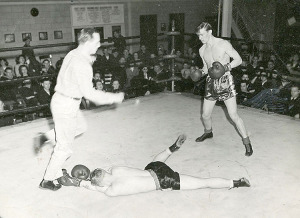 Zane (at right) boxing in the Navy for additional leave